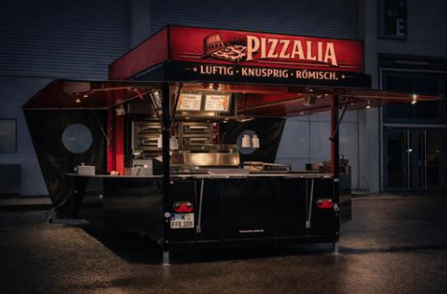 Modern food truck branded Pizzalia with illuminated signage showcasing its menu. Features a sleek, geometric design with an open cooking area and branded lighting.