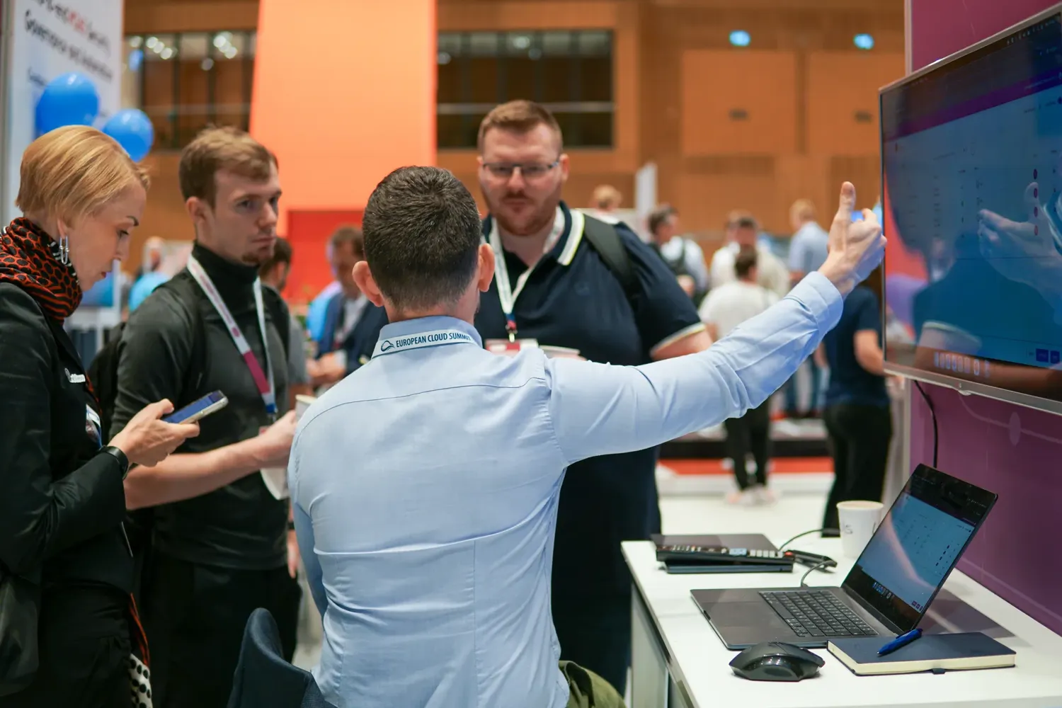 A product demonstration at an exhibitor booth in the ECS Expo