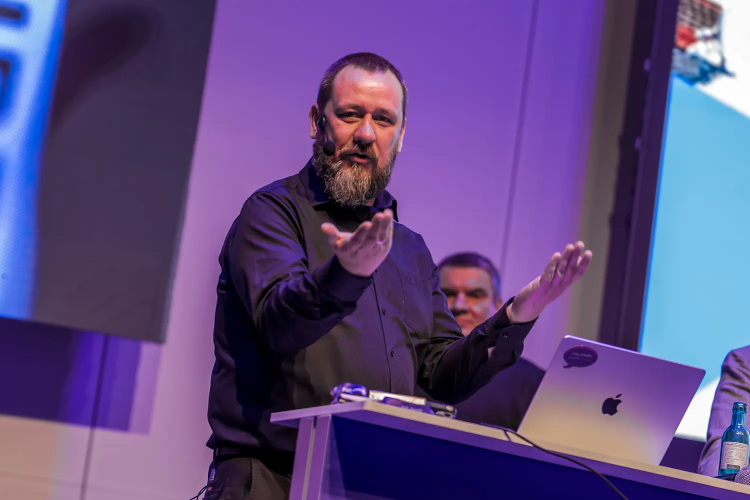 A speaker presenting at ECS
