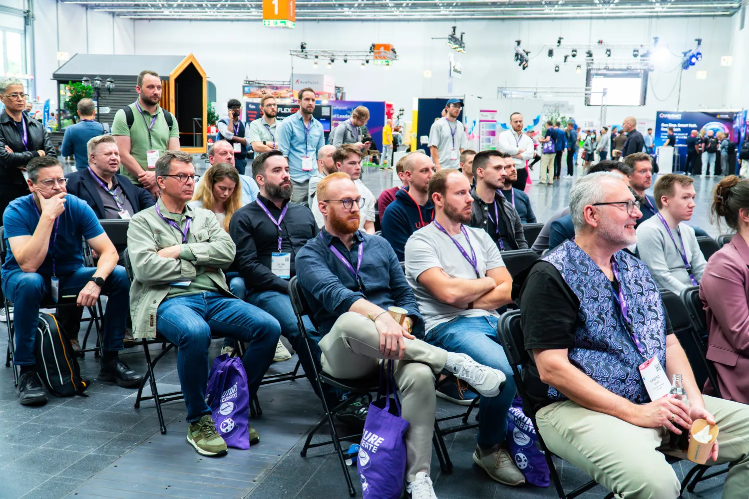 Attendees seated in a session at ECS