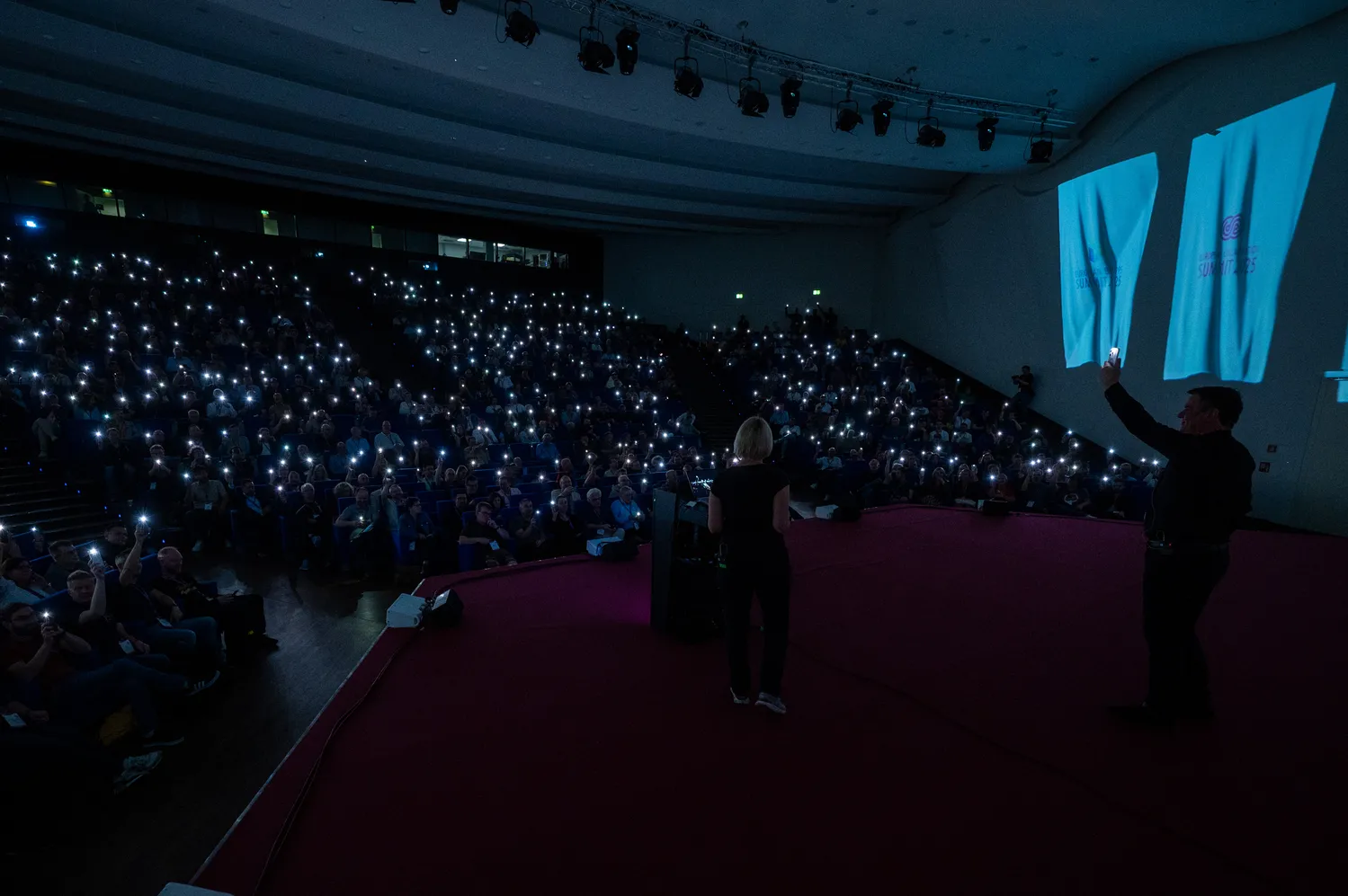 A full theatre-style hall during a keynote at ECS
