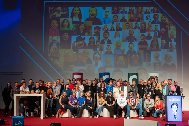 A large group of community members posing for a group photo