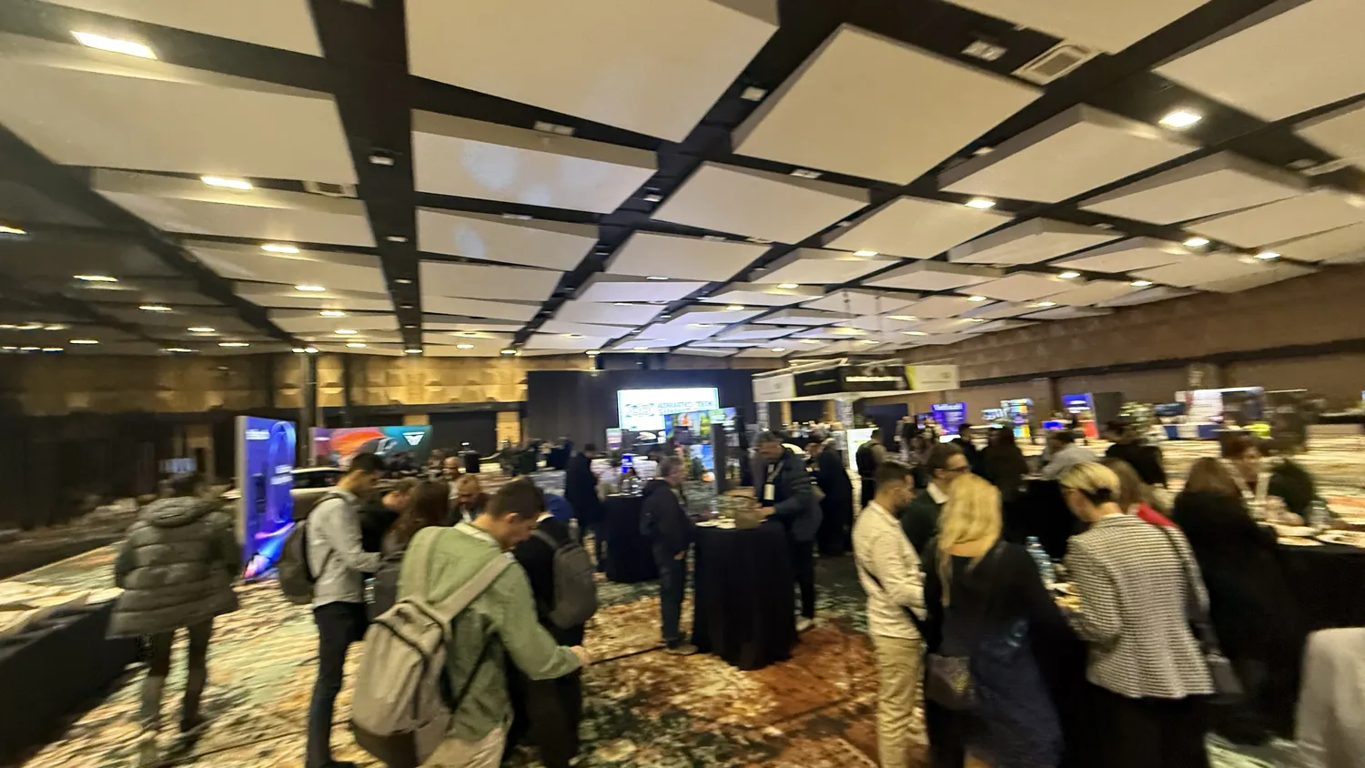 Attendees at exhibition booths on the ATS expo floor