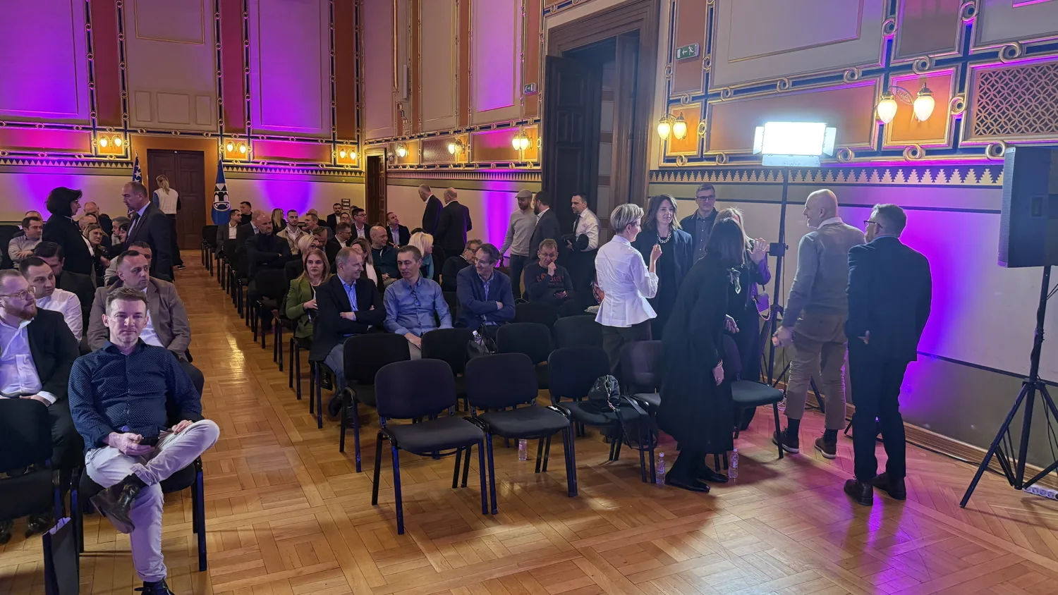 Conference attendees in conversation between sessions at Adriatics Tech Summit