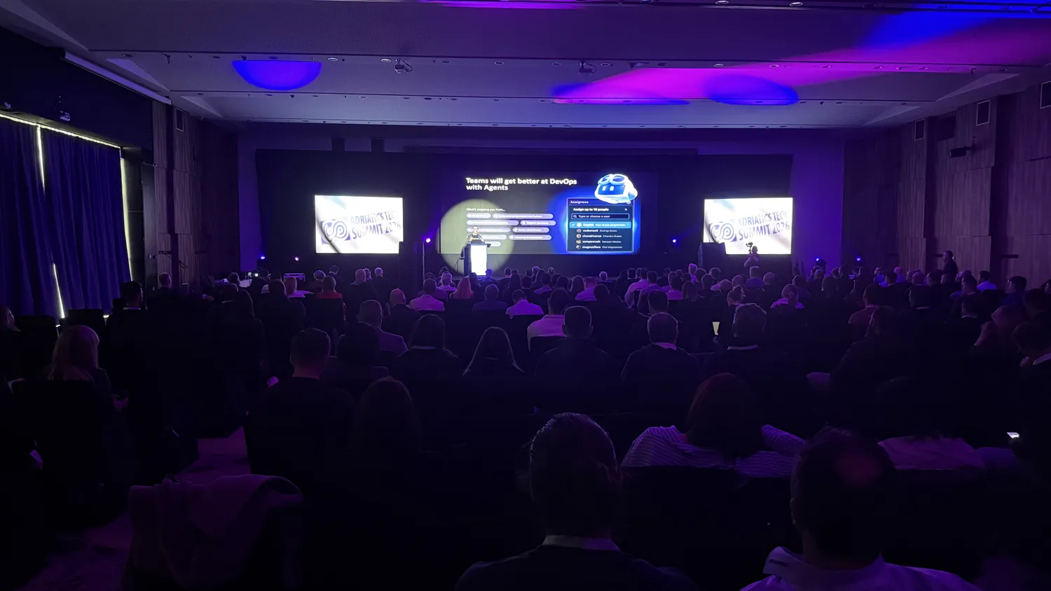 A speaker presenting to a full room at the Adriatics Tech Summit.