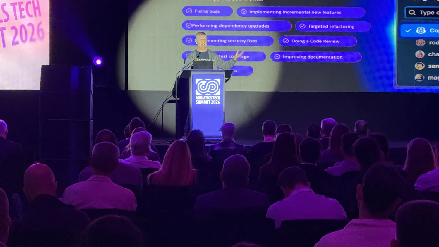 A speaker presenting on development practices at the Adriatics Tech Summit.