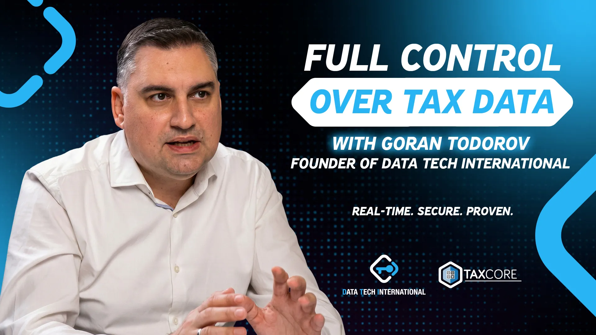 Professional man speaking during presentation on digital tax data solutions, emphasizing real-time, secure control with branding for Data Tech International and Taxcore.