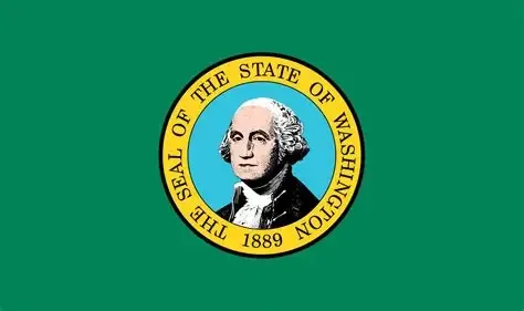 Historical state flag featuring the seal of Washington, depicting a portrait of George Washington within a circular blue background, set against a green field with text indicating its adoption in 1889.