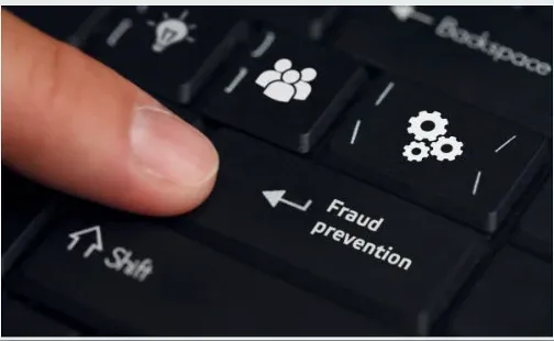 A hand presses a keyboard button highlighting fraud prevention features, including icons for team collaboration and mechanical gear systems. The screen displays the text "Fraud prevention" with directional arrows.