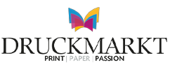 Colorful abstract logo featuring an open book with vibrant, stylized wings and text that reads "Druckmarkt PRINT PAPER PASSION" in bold, modern typography.